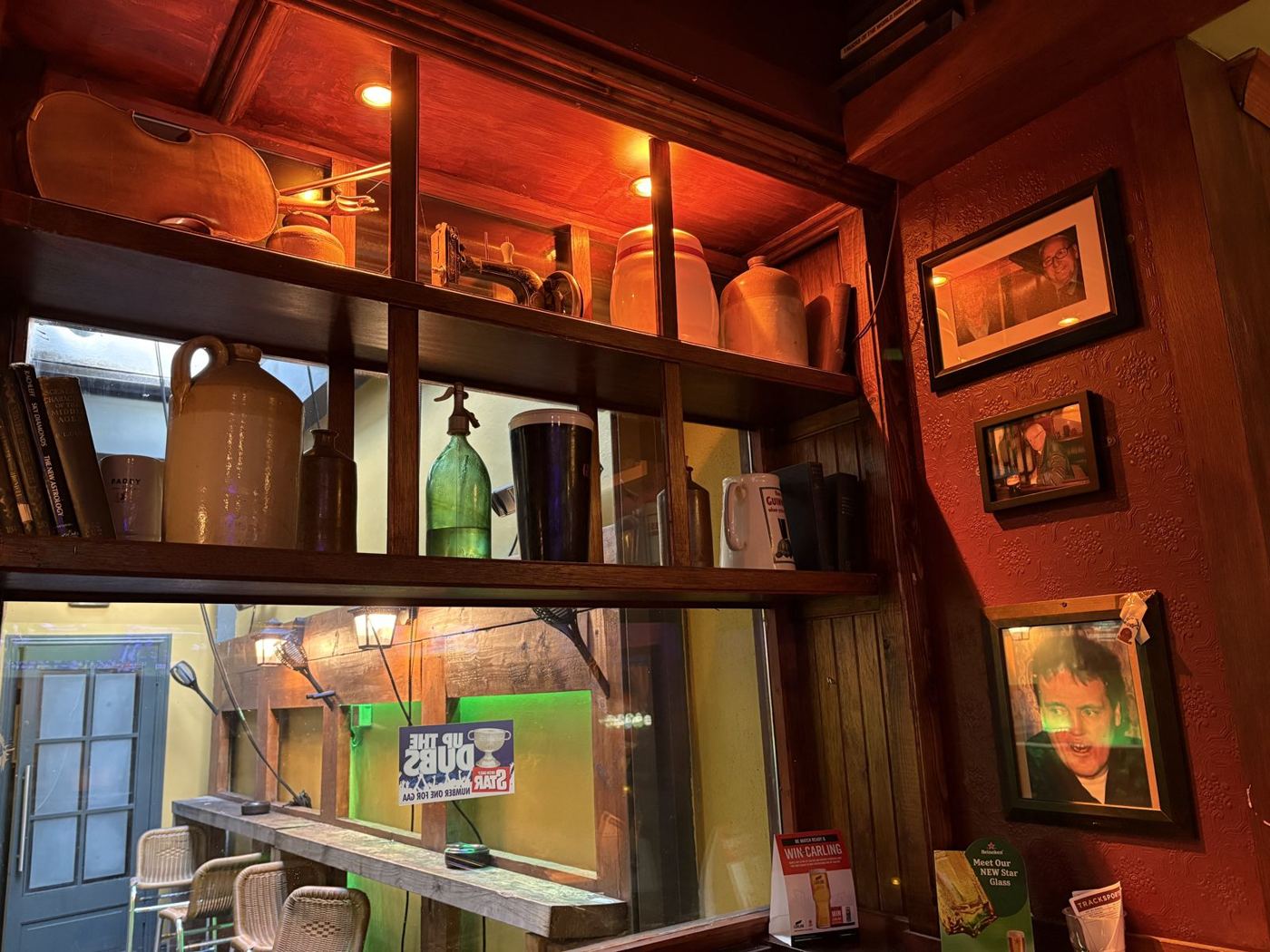 Shelves of old bottles and jugs above the bar