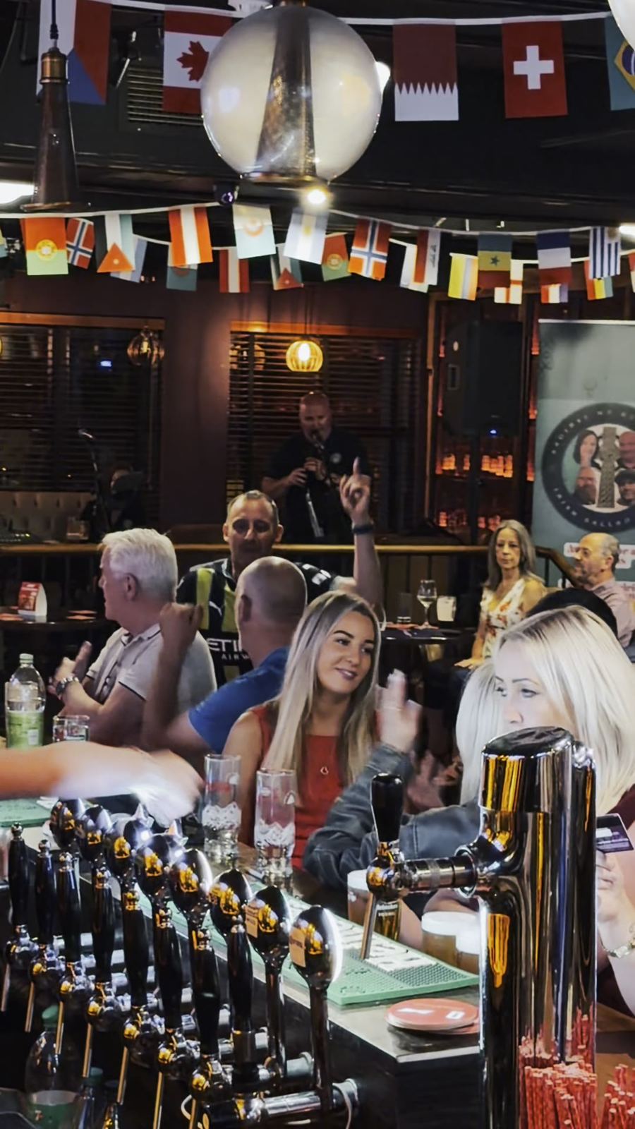 A busy night at the bar under the bunting