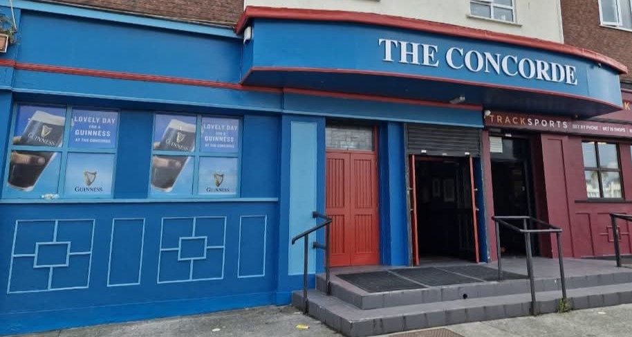 The Concorde's blue shopfront with red doors on Edenmore Avenue