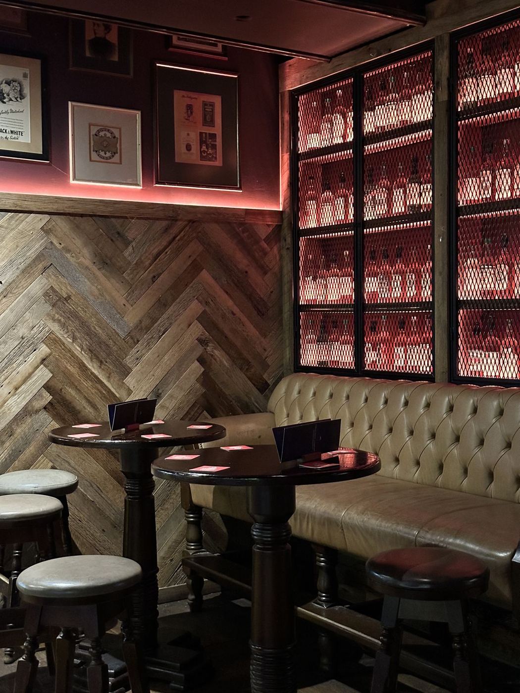 High tables and herringbone wood panelling
